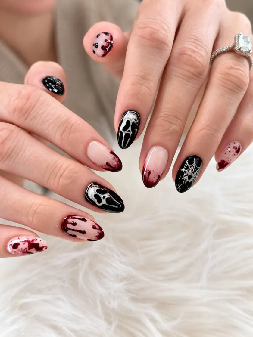 Black and burgundy nail art with delicate motifs